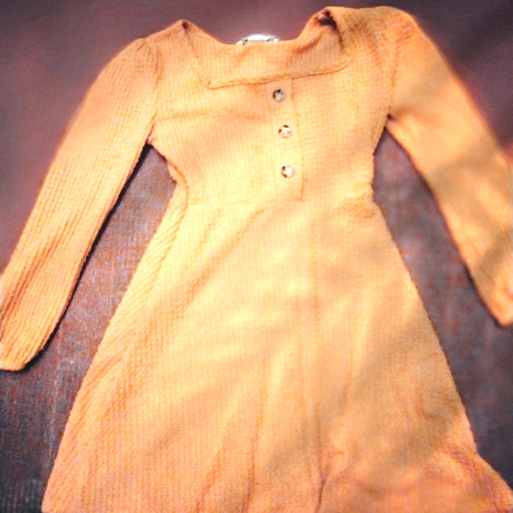 A little pastel orange dress with buttons